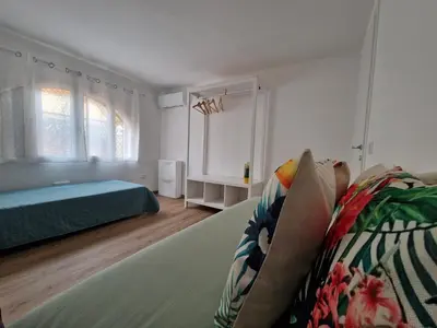 Letto o letti in una camera di Casa Felicita Garden Porto Frailis