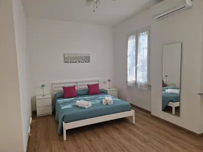 Letto o letti in una camera di Casa Felicita Garden Porto Frailis