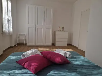 Letto o letti in una camera di Casa Felicita Garden Porto Frailis
