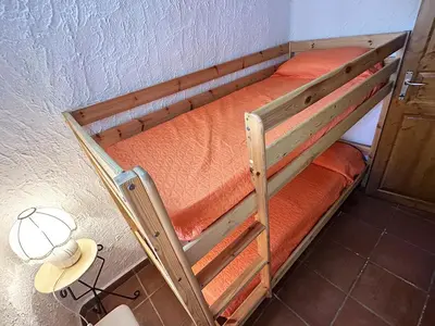 Letto o letti in una camera di App C163 con Terrazza a Sottotorre , Calasetta