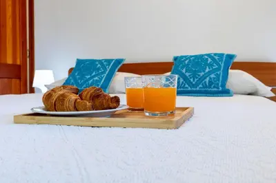 Letto o letti in una camera di Villa con Giardino - Accesso Diretto alla Spiaggia Giunco