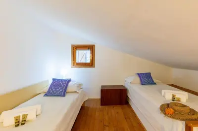 Letto o letti in una camera di Villa con Giardino - Accesso Diretto alla Spiaggia Giunco