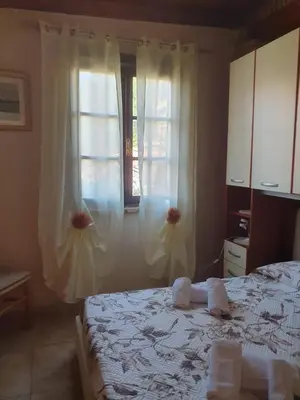 Letto o letti in una camera di Casa Elisa