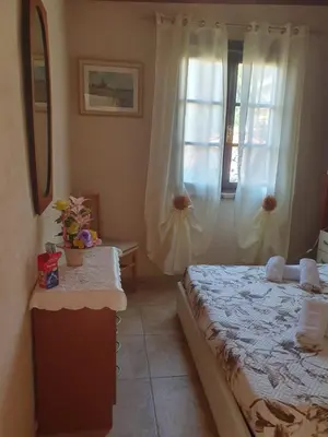 Letto o letti in una camera di Casa Elisa