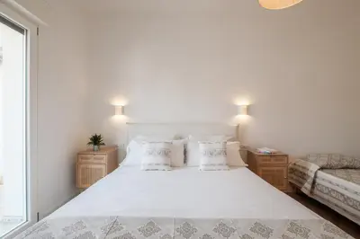 Letto o letti in una camera di Eleganza e design nel cuore di Villasimius - Spiaggia e movida