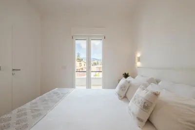Letto o letti in una camera di Eleganza e design nel cuore di Villasimius - Spiaggia e movida