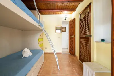 Letto o letti in una camera di Casa Nucci - Free WIFI - 100mt from the beach