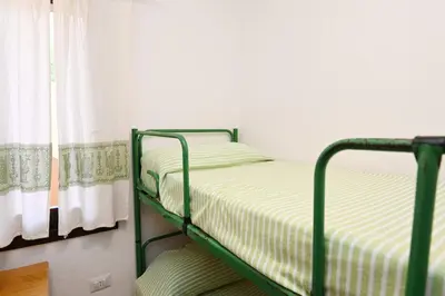 Letto o letti in una camera di AmareSardegna11 con giardino