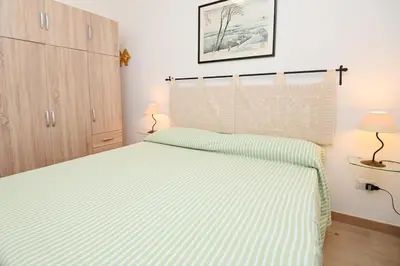 Letto o letti in una camera di AmareSardegna11 con giardino