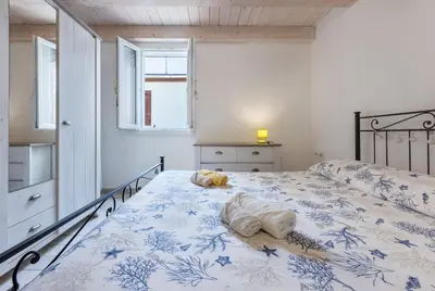 Letto o letti in una camera di GuestHost - La Ca' Rosa