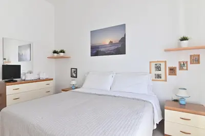 Letto o letti in una camera di IzzHome BiHappy