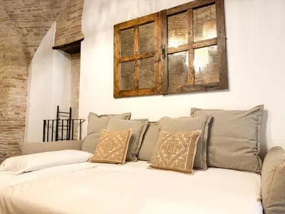Letto o letti in una camera di Kalma Arched Loft - Unique Brick Vault in City Heart