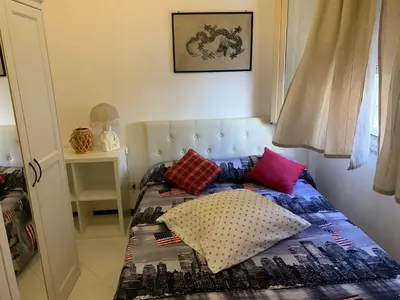 Letto o letti in una camera di Casa Azzurra