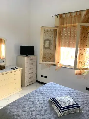 Letto o letti in una camera di Casa Azzurra
