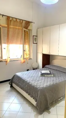 Letto o letti in una camera di Casa Azzurra