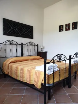 Letto o letti in una camera di Agriturismo Villino Elena
