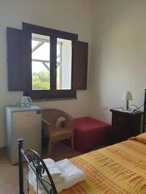 Letto o letti in una camera di Agriturismo Villino Elena
