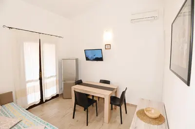 TV o dispositivi per l'intrattenimento presso AmareSardegna12 con vista mare