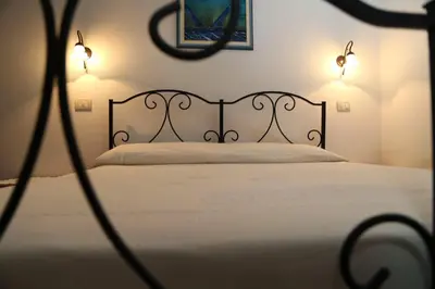 Letto o letti in una camera di B&B Tre - Rooms & Relax