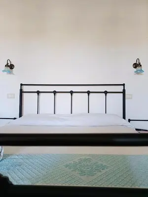 Letto o letti in una camera di B&B Tre - Rooms & Relax