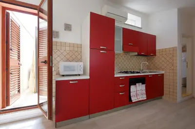 Cucina o angolo cottura di Glicine e sole by Teuladaapartments