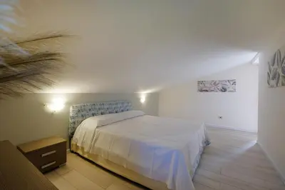 Letto o letti in una camera di Glicine e sole by Teuladaapartments