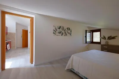Letto o letti in una camera di Glicine e sole by Teuladaapartments