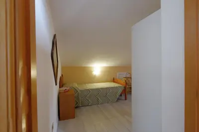 Letto o letti in una camera di Glicine e sole by Teuladaapartments