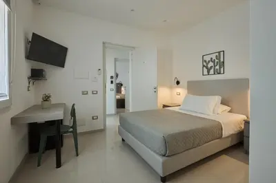Letto o letti in una camera di ARGHENTU Rooms