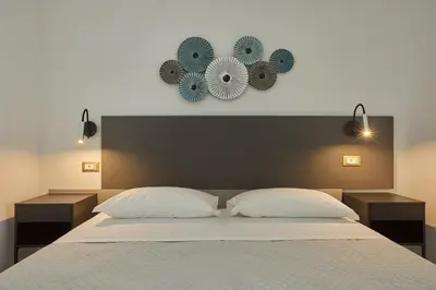 Letto o letti in una camera di ARGHENTU Rooms