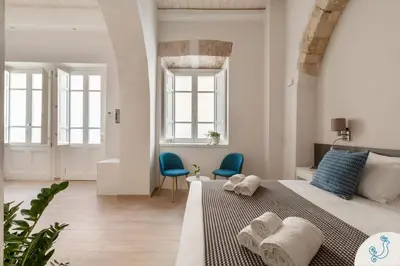 Letto o letti in una camera di Domus Carolina - Stylish living in the soul of Cagliari