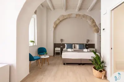 Letto o letti in una camera di Domus Carolina - Stylish living in the soul of Cagliari