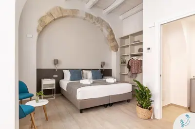 Letto o letti in una camera di Domus Carolina - Stylish living in the soul of Cagliari