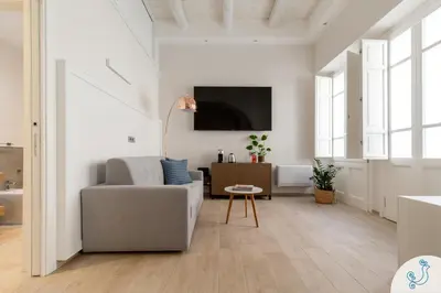 TV o dispositivi per l'intrattenimento presso Domus Carolina - Stylish living in the soul of Cagliari