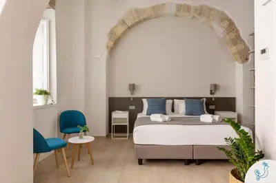 Letto o letti in una camera di Domus Carolina - Stylish living in the soul of Cagliari