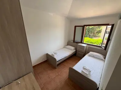Letto o letti in una camera di La Terrazza Sa Cruxitta