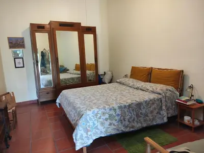 Letto o letti in una camera di Domu de mannai - Casa vacanze in Sardegna