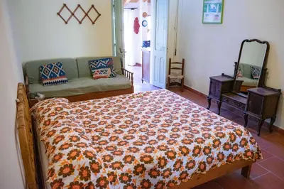 Letto o letti in una camera di Domu de mannai - Casa vacanze in Sardegna