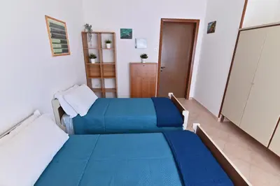 Letto o letti in una camera di IzzHome TriHappy