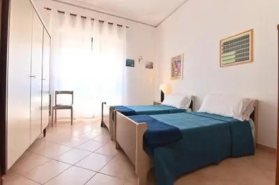 Letto o letti in una camera di IzzHome TriHappy