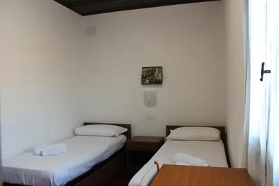 Letto o letti in una camera di Residence Baia Azzurra