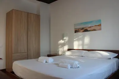 Letto o letti in una camera di Residence Baia Azzurra