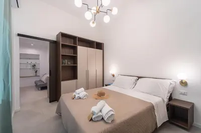 Letto o letti in una camera di EJA DOMUS - Casa Vacanza Cagliari