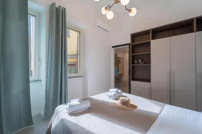 Letto o letti in una camera di EJA DOMUS - Casa Vacanza Cagliari