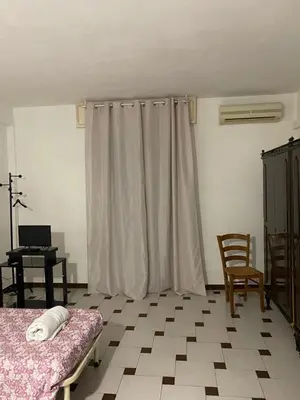 Letto o letti in una camera di casa vacanze Esperu