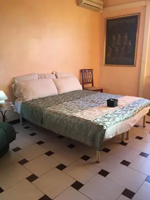 Letto o letti in una camera di casa vacanze Esperu