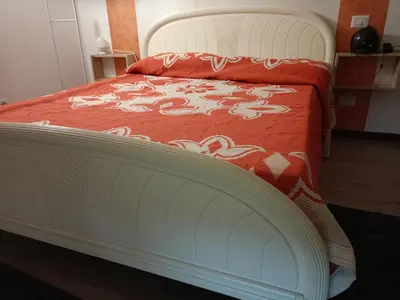 Letto o letti in una camera di Casa Eleonora