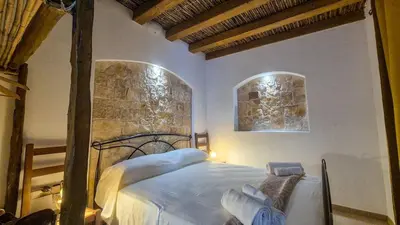 Letto o letti in una camera di Borgo Antico - Paglia d'Oro