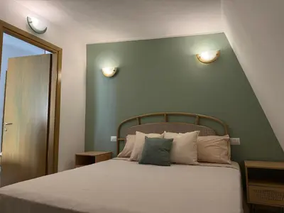 Letto o letti in una camera di Rica's APT
