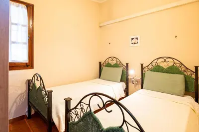Letto o letti in una camera di Villetta Elena